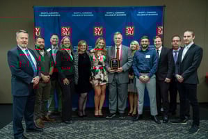 team holding an award